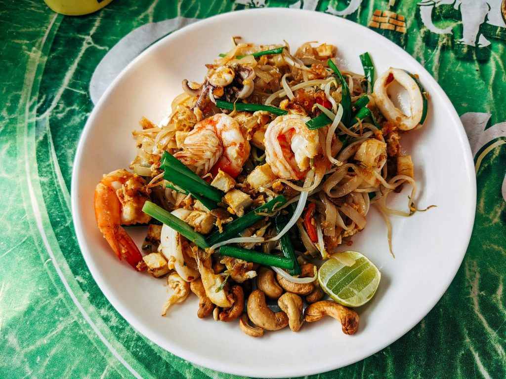 pad thai in white ceramic plate