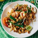 pad thai in white ceramic plate